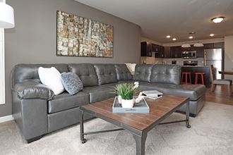 Furnished Living Room with Large Couch and Coffee Table