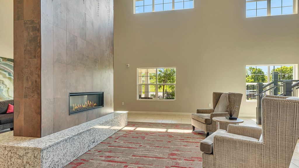 a living room with couches and a fireplace