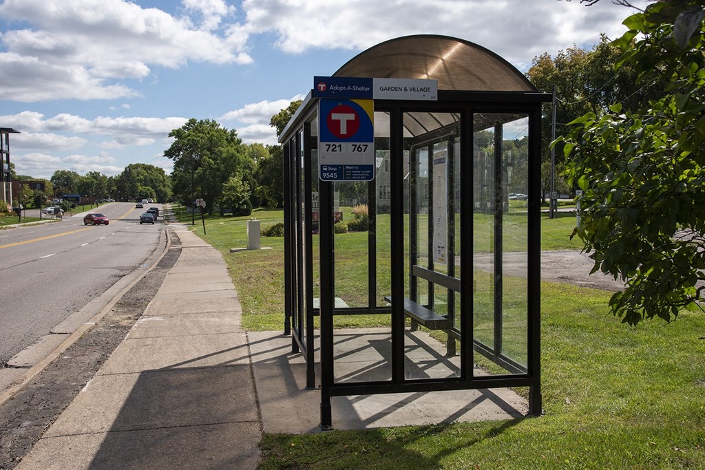 a bus stop on the side of a road