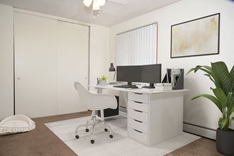 a home office with a desk and a computer