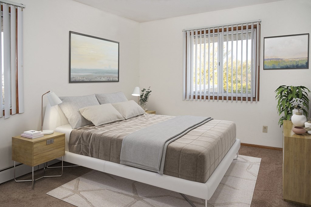 a bedroom with a bed and two windows