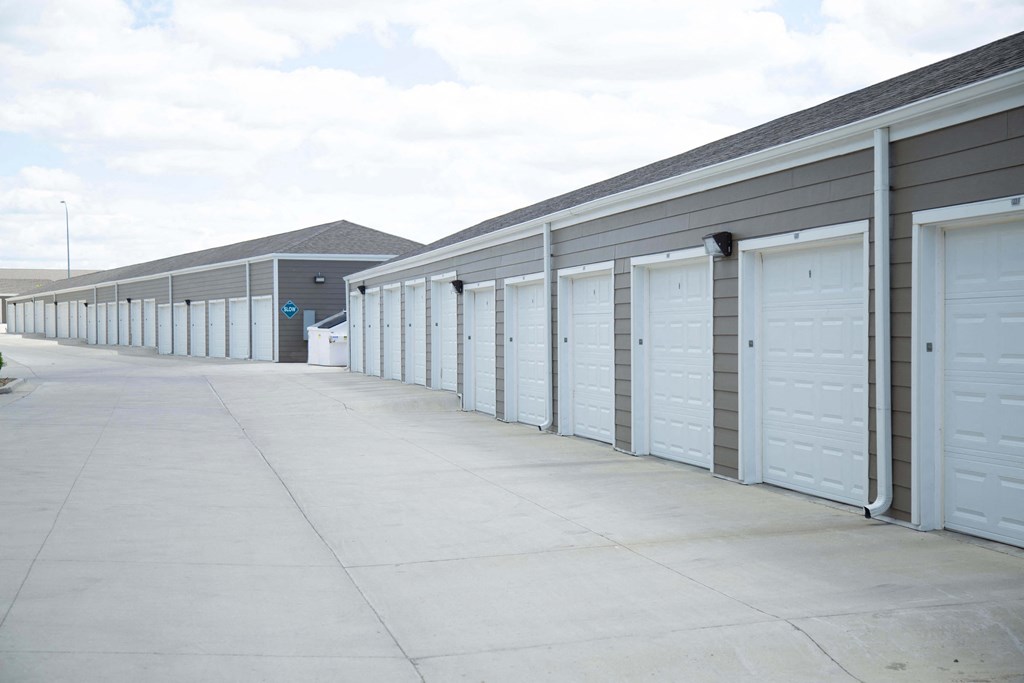 Large driveway with detached garage parking available.