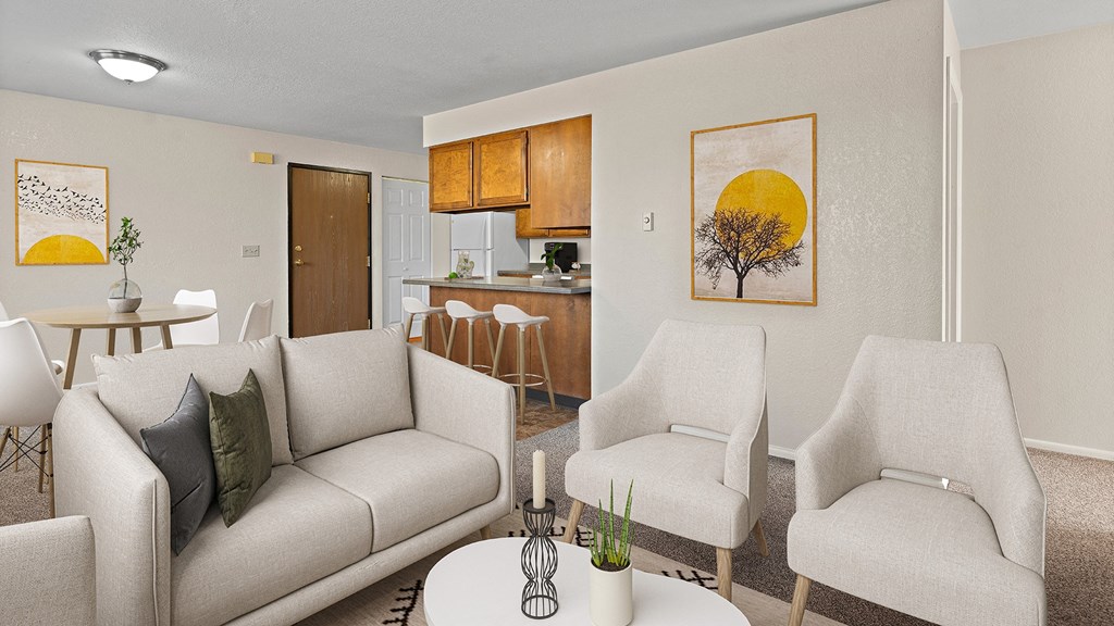 a living room with couches and chairs and a table