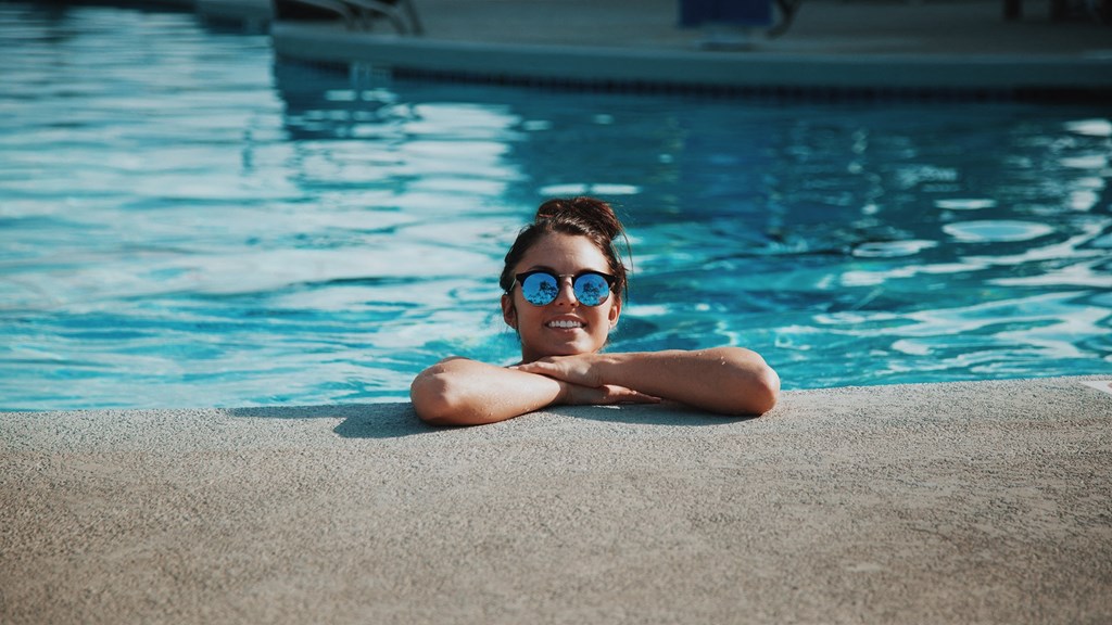 a young boy in a swimming pool