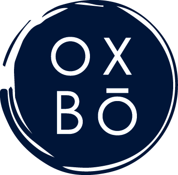 a blue circle with theoxbo logo on a green background