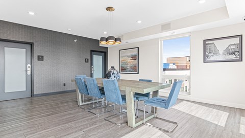 a dining room with a table and chairs