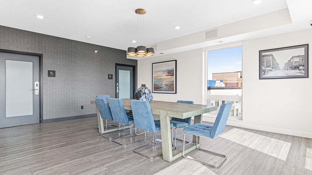 a dining room with a table and chairs