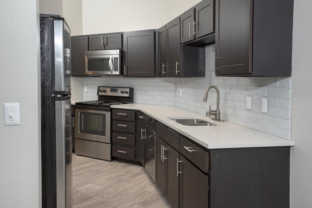 Kitchen with Fridge and Cabinets