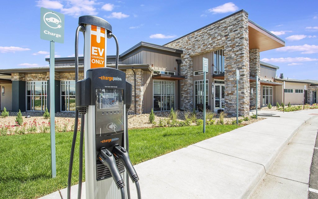 Electric car charging station right outside lobby entrance