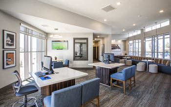 Business center with two computer terminals, co working tables