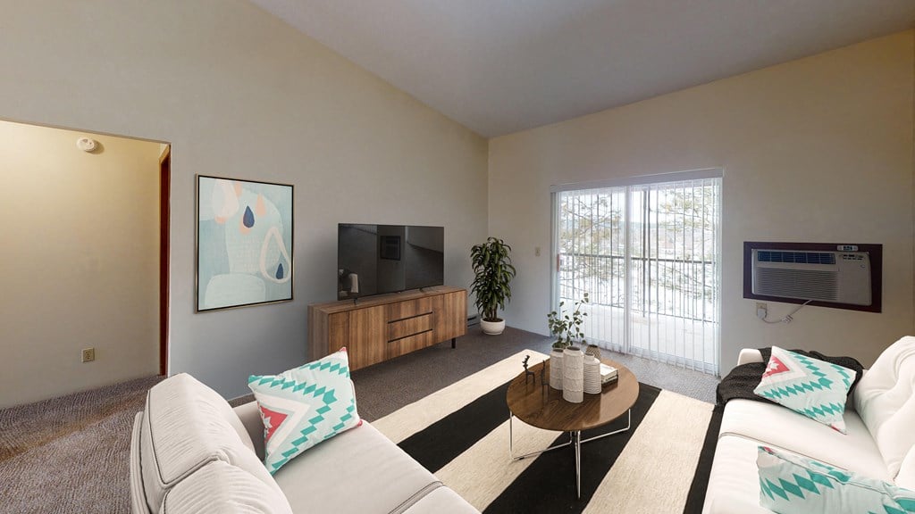 Bright and airy living space with natural light from the patio doors.