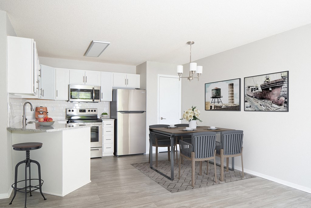 Stunning kitchen with stainless steel appliances, white cabinets and plenty of room