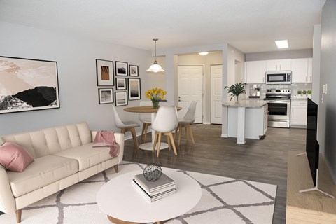 a living room and kitchen with a white couch and a table