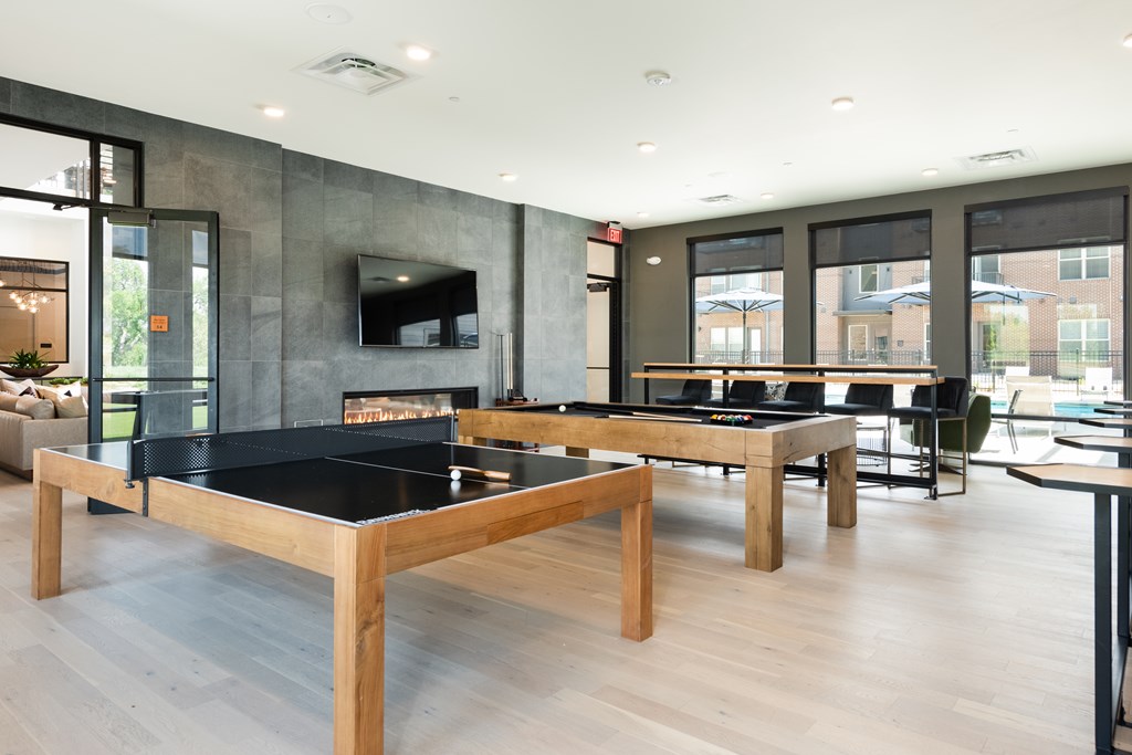 Clubhouse Game Room with ping pong, pool and fireplace views
