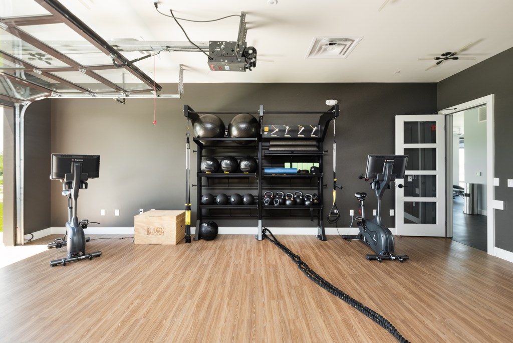 Fitness Center with stationary bikes, medicine balls, and kettle bells 