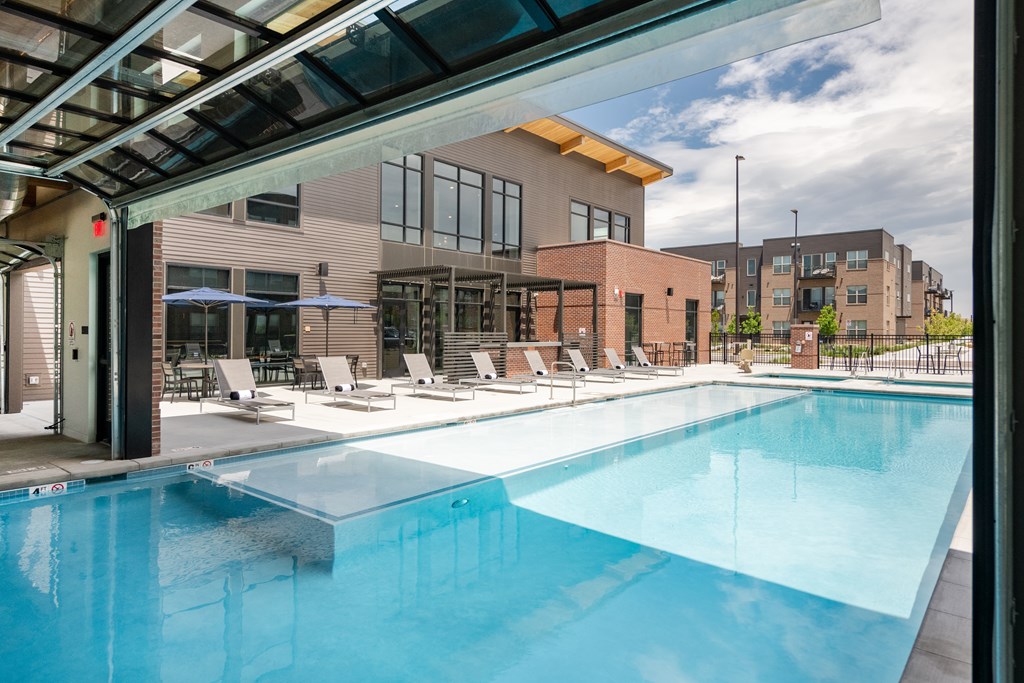 A resort-style indoor and outdoor pool and cabanas