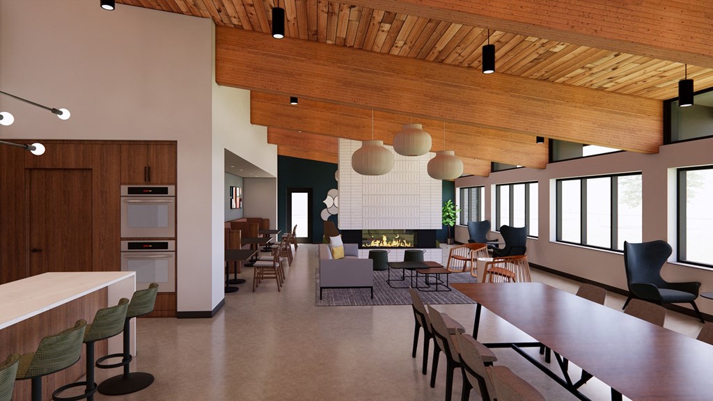 a large living room with a fireplace and tables and chairs