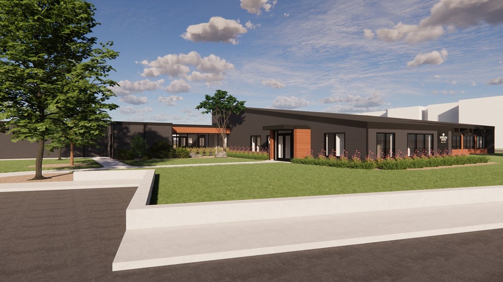 a rendering of a building with a lawn and a sidewalk