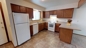 Full Kitchen with Wood Cabinets and Appliances - Photo Gallery 2