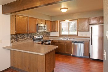 Full Kitchen with Attached Island, Wood Cabinets and Stainless Steel Appliances - Photo Gallery 3