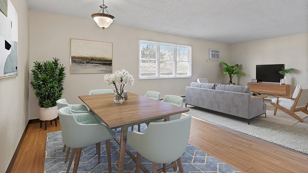 a living room with a table and chairs and a couch