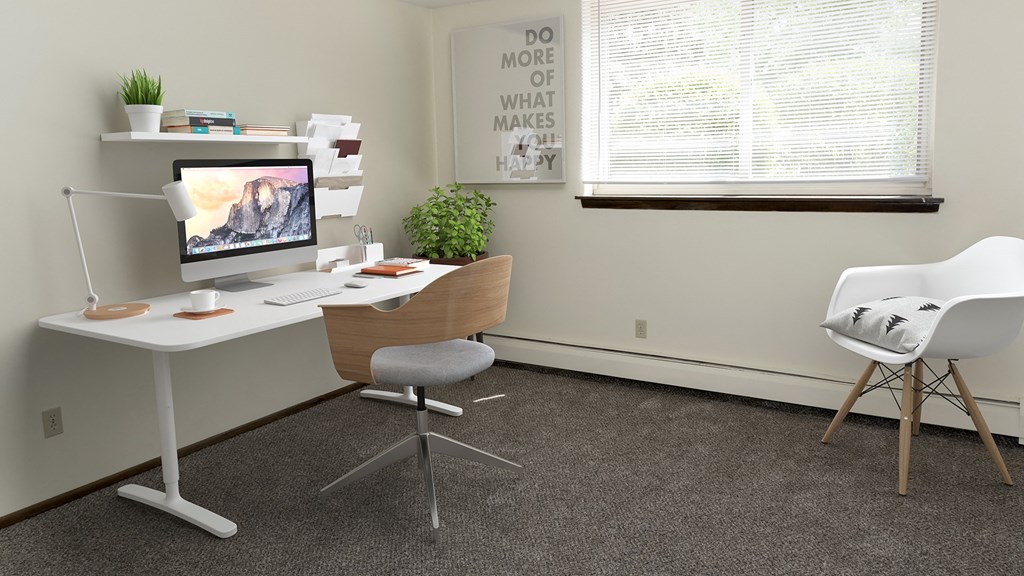 an office with a white desk and chair and a computer
