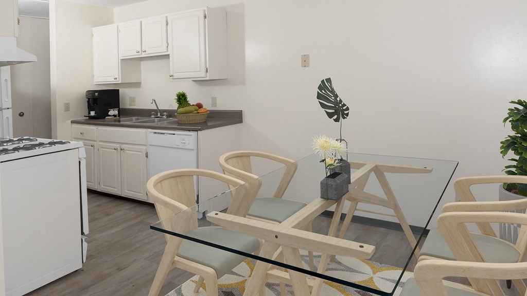 a dining room with a glass table and chairs in a kitchen