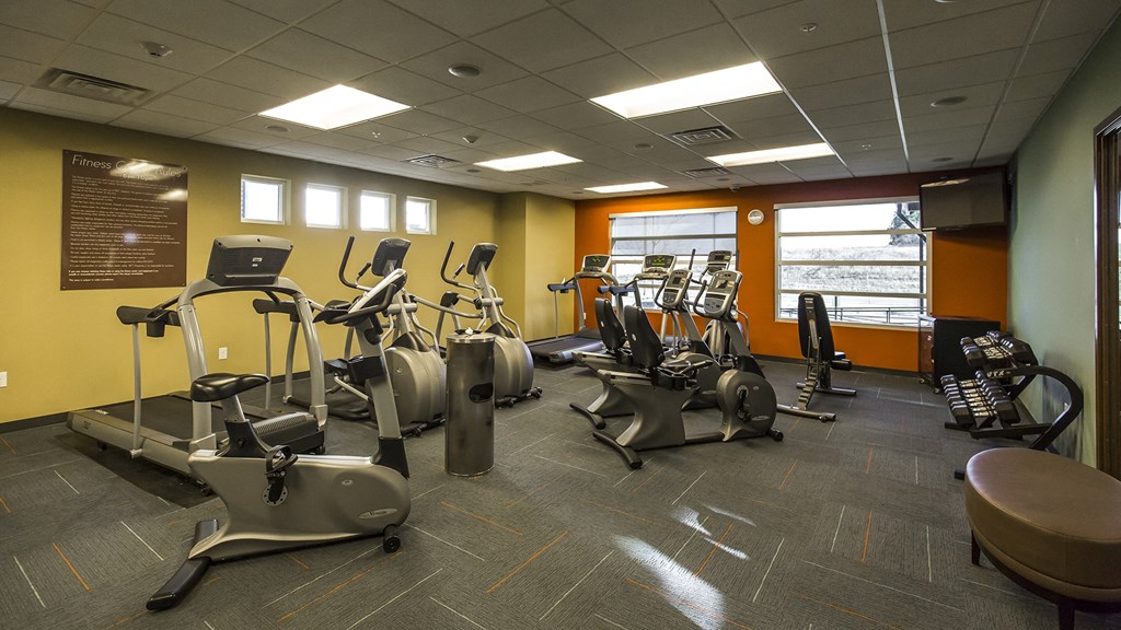 a gym with various exercise equipment in a building