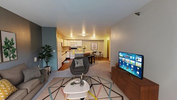 Furnished, Carpeted Living Room with TV and Decorative Rug - Photo Gallery 3