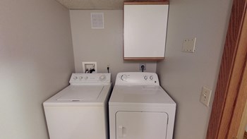 In Unit Washer Dryer with mounted cabinet above. - Photo Gallery 5