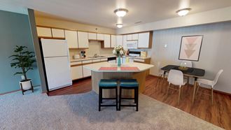 Full Kitchen with Island and White Cabinets, Small Dining Table
