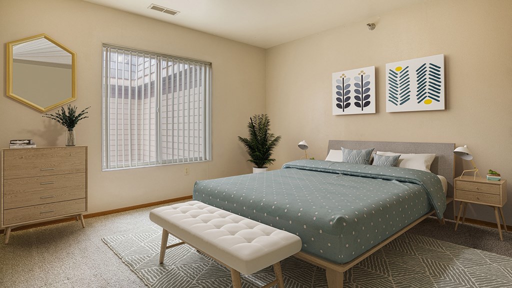 a bedroom with a bed and a dresser and a window