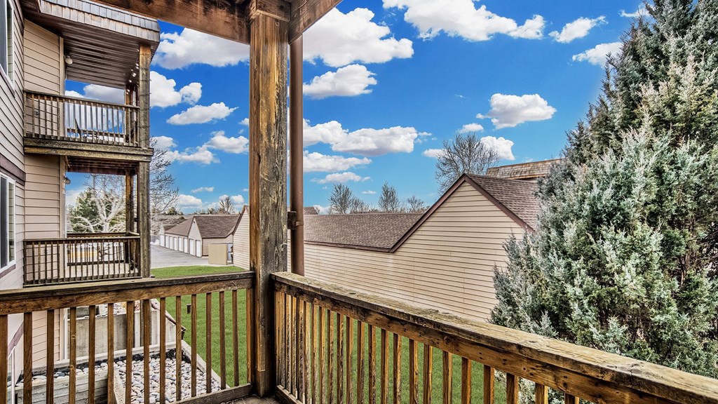 the view from the deck of a home with a porch