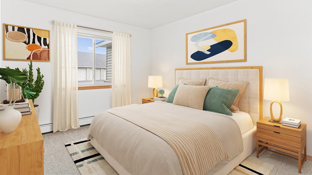 a bedroom with a bed and paintings on the wall