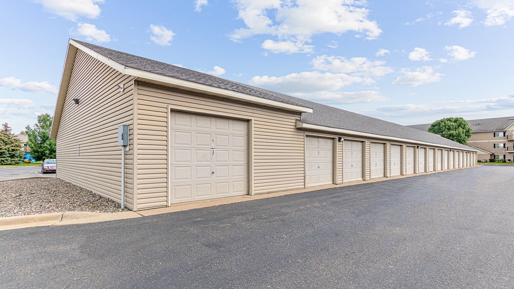 a large garage with multiple doors on the side of a building