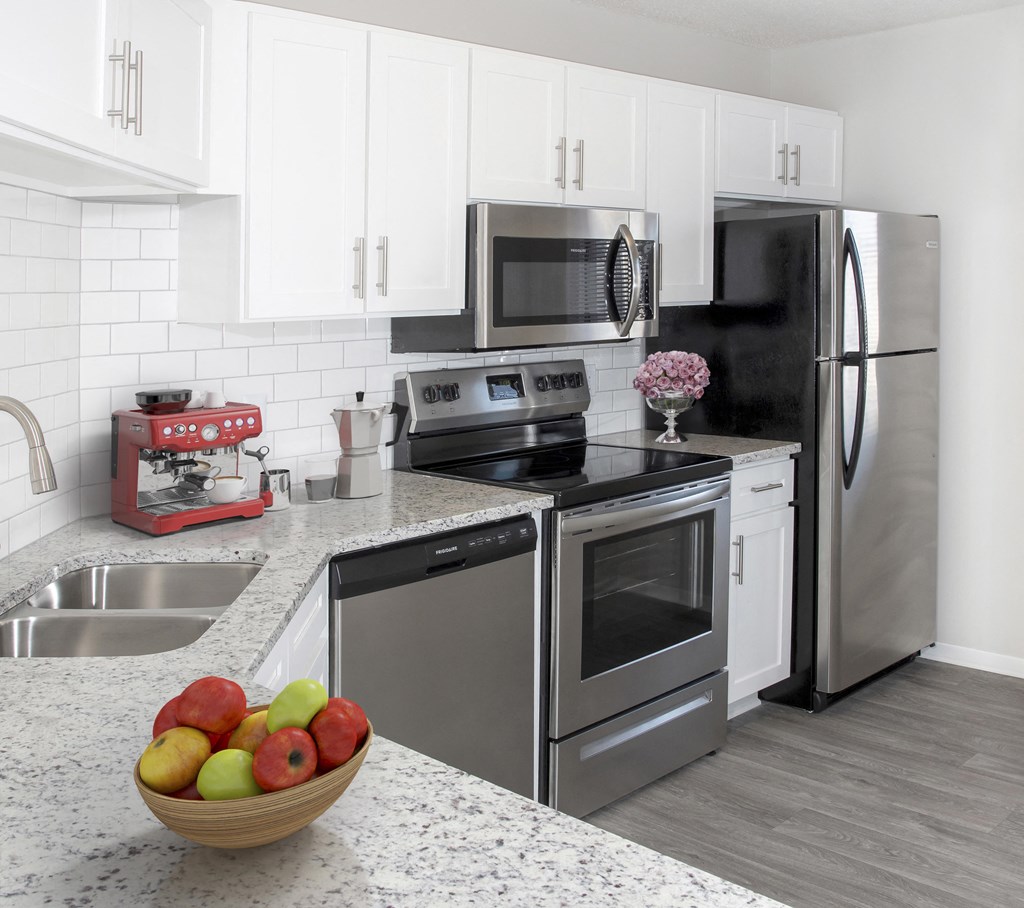 Kitchen with White Cabinets and Granite Countertops