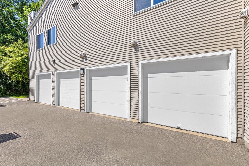 A building with four garage doors in front.