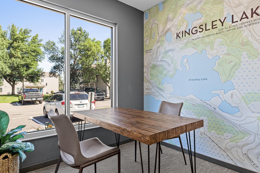 A Kingsley Lake map is displayed on a wall in a room with a table and chairs.