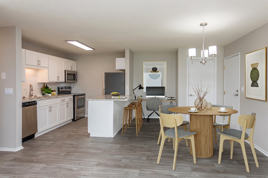 Kitchen connected to living room with circular dining table