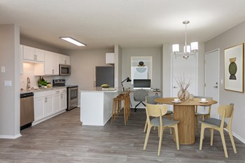 Kitchen connected to living room with circular dining table - Photo Gallery 3