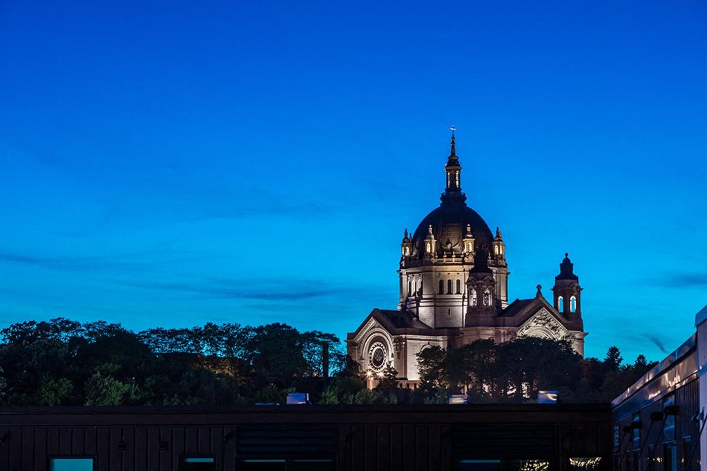 a church at night with a blue sky in the background