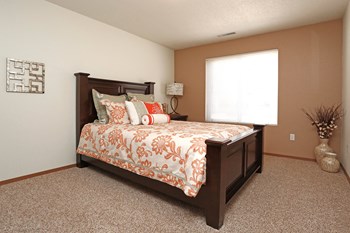 Spacious master bedroom complete with a large window. - Photo Gallery 5