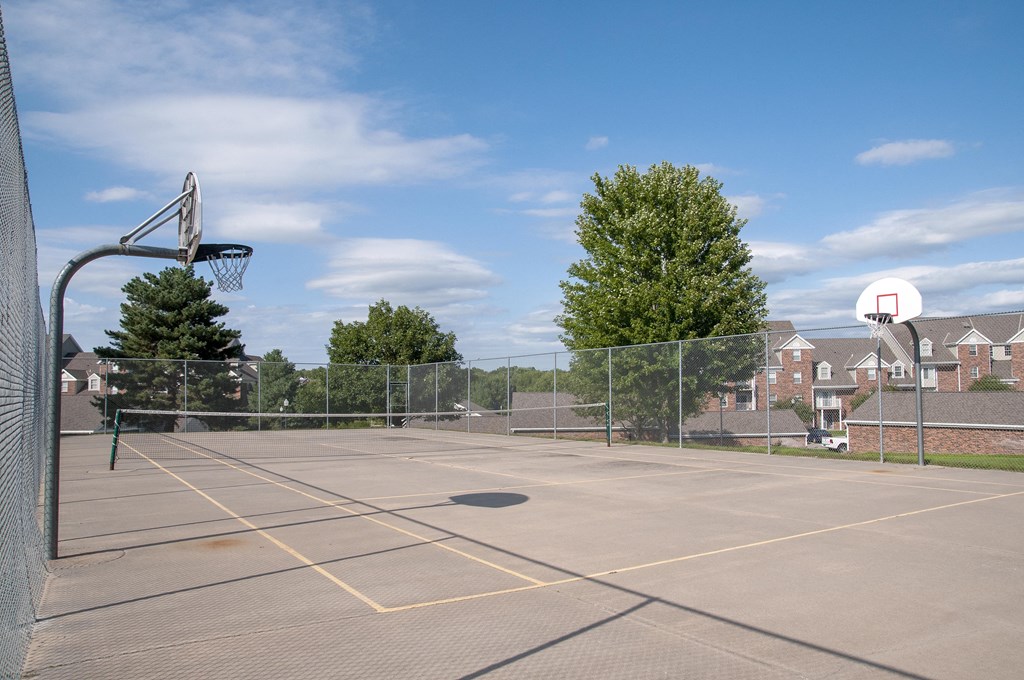 Outdoor Fenced Basketball Court with Two Hoops at The Donovan Apartment Homes, Lincoln, Nebraska