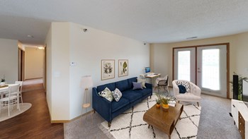 A large and sleek living room perfect for entertaining with your own private patio or balcony access. - Photo Gallery 5