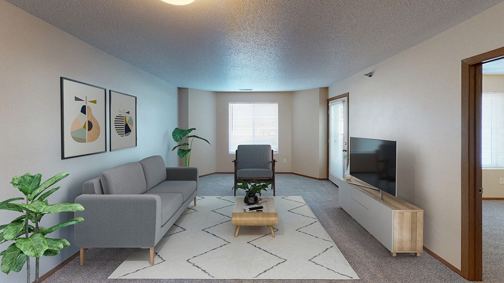 Furnished living room with sofa, television and windows for natural light