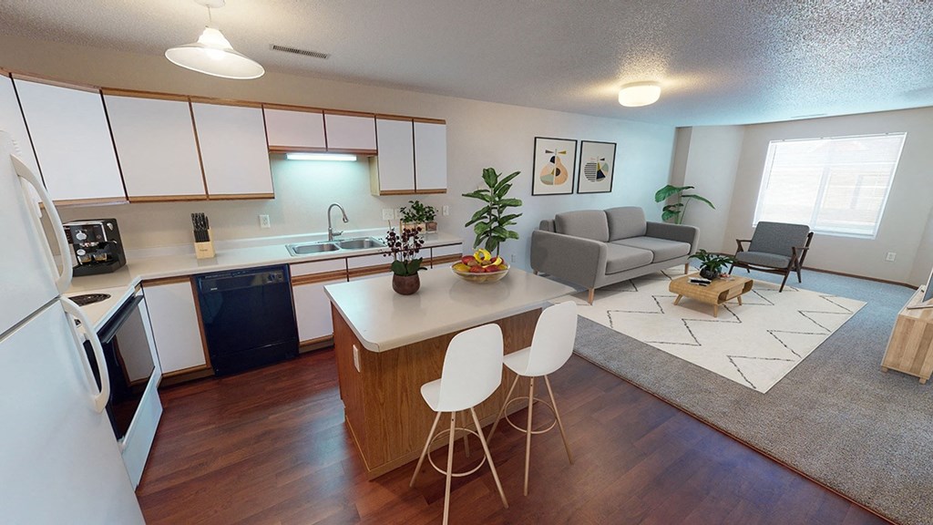 Kitchen with attached living and eat at island, white paneled cabinetry