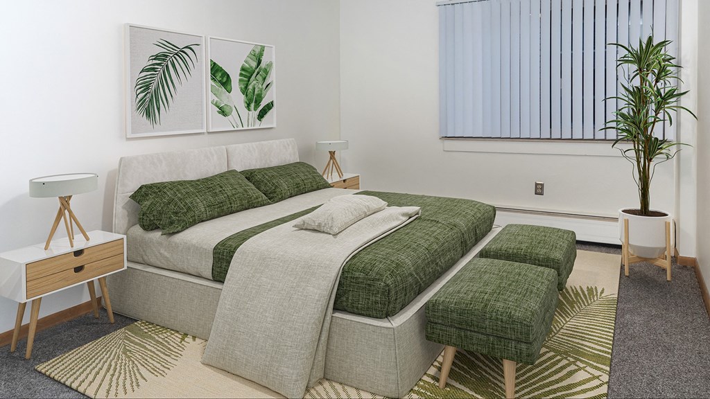 a bedroom with a bed and two ottomans