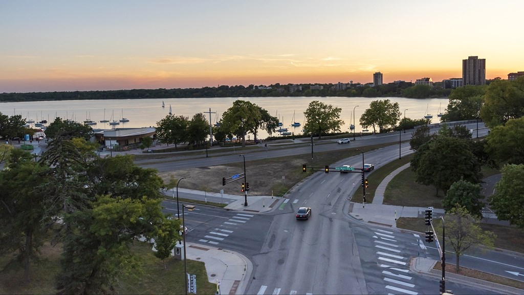 a city street with a river in the background
