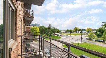 View of Lake Bde Maka Ska from private balcony with metal railing