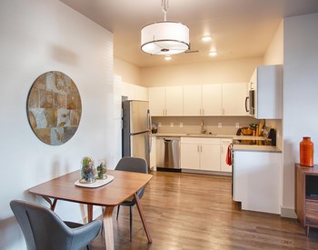 Kitchen with White Cabinets and Small Dining Table - Photo Gallery 4